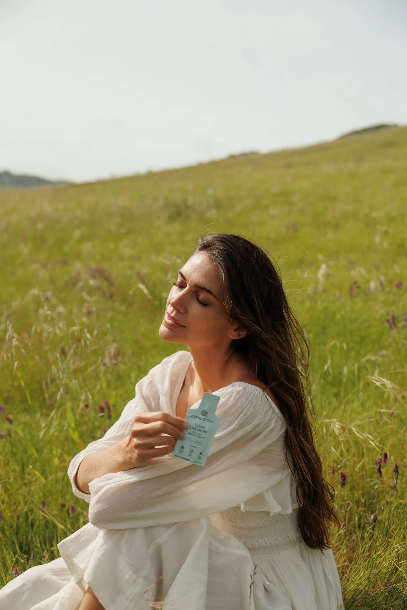 Woman in a field with Colostrum