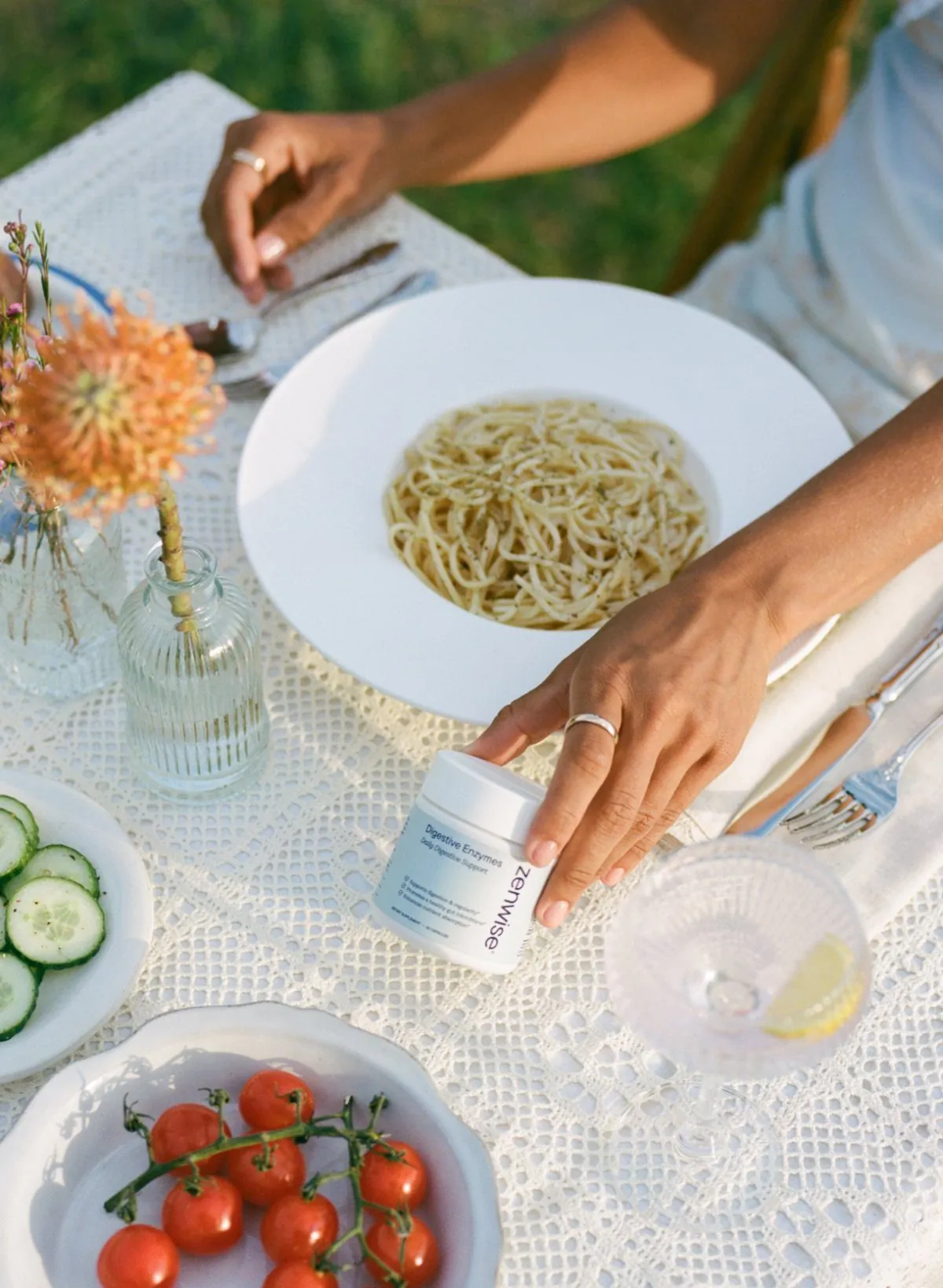 Hand reaching for Digestive Enzymes at the table