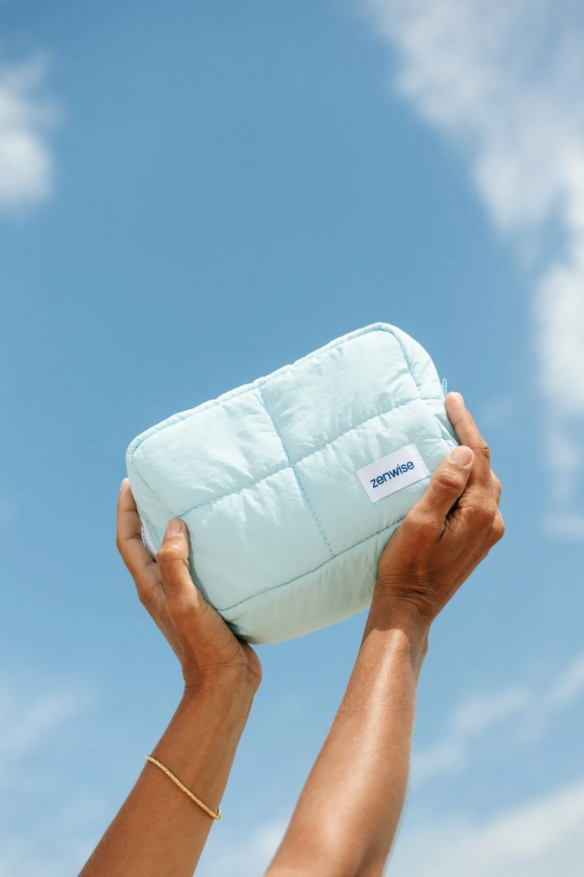 Travel pouch held against the sky